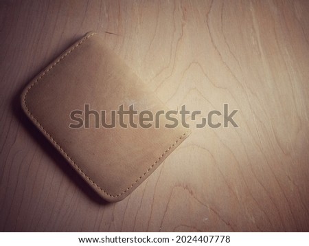 Brown Wallet on wood table background