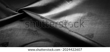 silk fabric Dark black small pattern, a pattern that is a combination of lines, colors, shadows. texture background, pattern