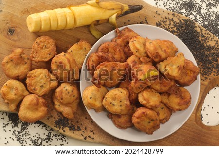 Plantain fritters. Plantain slices dipped in whole wheat flour batter and deep fried in coconut oil. Kerala special called ethakka appam. Royalty-Free Stock Photo #2024428799