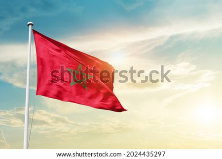 Morocco national flag waving in beautiful clouds. Royalty-Free Stock Photo #2024435297