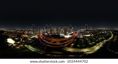 Lowlight panorama shot of nighttime downtown Houston, Texas skyline.