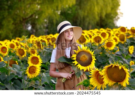 teen girl on a field of sunflowers