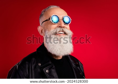 Photo of cheerful inspired man look empty space toothy smile wear sunglass leather jacket isolated on red color background Royalty-Free Stock Photo #2024528300