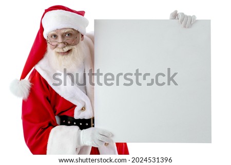 Santa Claus with whiteboard for copy space, mock up on white background isolated. Senior male actor old man with a real white beard in the role of Father Christmas