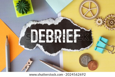 debrief word in a dictionary. debrief concept Royalty-Free Stock Photo #2024562692
