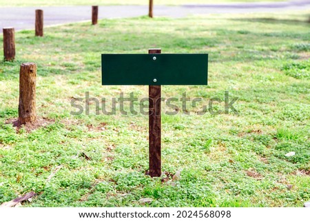 Small green wooden sign for mockup.  Copy space.