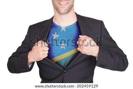 Businessman opening suit to reveal shirt with flag, Solomon Islands