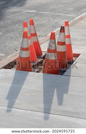 Construction site with pylons and sidewalk