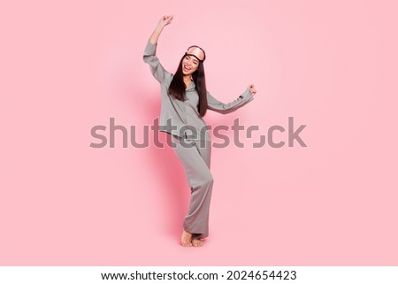 Full length photo of pretty funny woman nightwear mask smiling dancing isolated pink color background Royalty-Free Stock Photo #2024654423