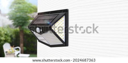 Small solar powered led light with motion sensor	 Royalty-Free Stock Photo #2024687363