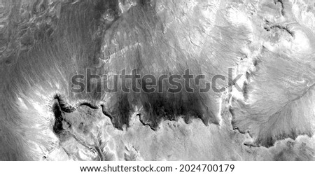 petrified wave,  abstract photography of the deserts of Africa from the air in black and white, aerial view of desert  Genre: Abstract Naturalism, from the abstract to the figurative, 