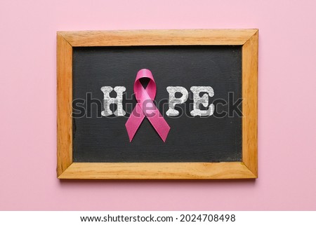 Breast cancer awareness flatlay layout concept over pink background