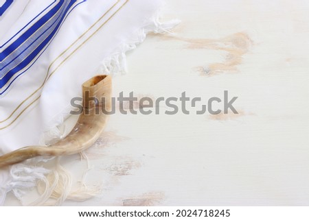 religion image of shofar (horn) on white prayer talit. Rosh hashanah (jewish New Year holiday), Shabbat and Yom kippur concept Royalty-Free Stock Photo #2024718245
