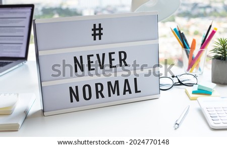 Never normal text on lightbox on desk.big changing or lifestyle concepts.no people