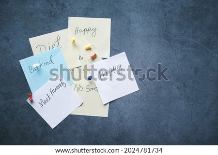 new year goals on a sticky note on table ,