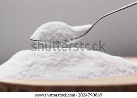 Put natural sweetener stevia from a pile into a spoon Royalty-Free Stock Photo #2024790869