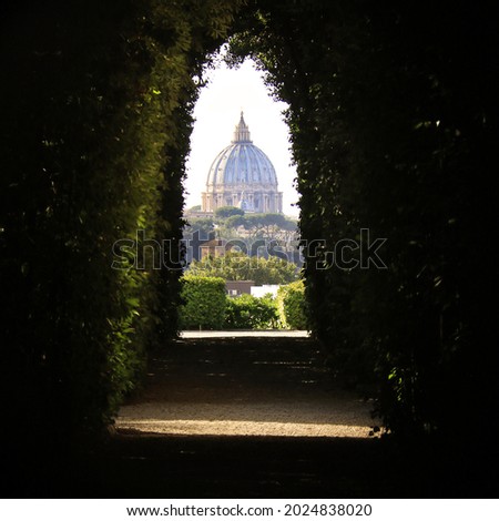 An amazing view of St. Peter's Dome through the Knights of Malta keyhole on the Aventine Hill in Rome. Royalty-Free Stock Photo #2024838020