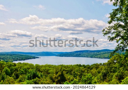 Scenic view of Keuka Lake, one of the major Finger Lakes in the U.S. state of New York.  It is Y-shaped, in contrast to the long and narrow shape of the other Finger Lakes. Summer scenes. Royalty-Free Stock Photo #2024864129