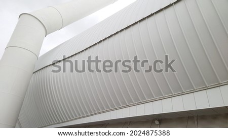 Photo of a modern stadium. The modern architecture of the stadium. Fragment of the facade of a modern stadium.