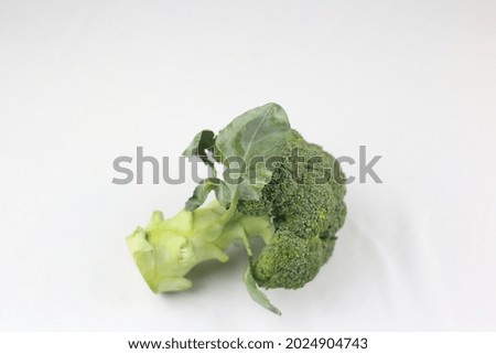 Green broccoli with a picture on a white background.