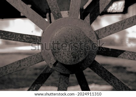 Monochromatic photo of horse wagon isoletad wheel