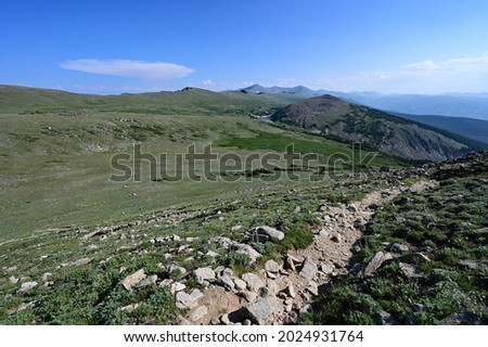 Alpine tundra above tree line on High Lonesome Trail in Indian Peaks Wilderness in Arapaho National Forest, Colorado on clear sunny summer afternoon. Royalty-Free Stock Photo #2024931764