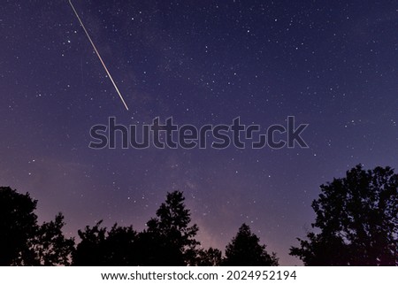 PERSEID METEOR SHOWER WITH FALLING STAR AND MILKY WAY Royalty-Free Stock Photo #2024952194