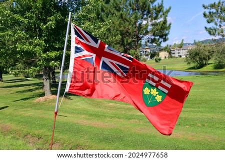 Ontarian provincial flag patriotic element official symbol. Flag of the Canadian province of Ontario on flagpole waving