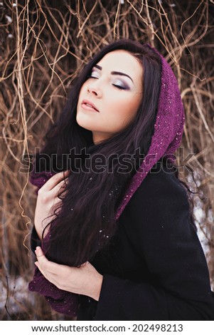 Portrait pretty woman with purple scarf-collar