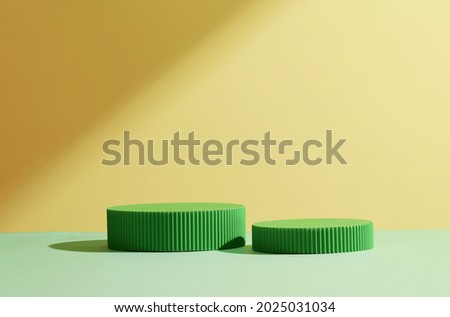 Abstract background for branding and minimal presentation. Green  podium, on folding paper pleated geometric beige background.