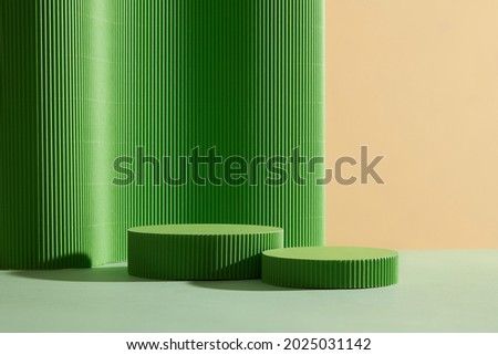 Abstract background for branding and minimal presentation. Green  podium, on folding paper pleated geometric background.