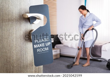 Housekeeper Cleaning Hotel Room. Bedroom Cleaner Service