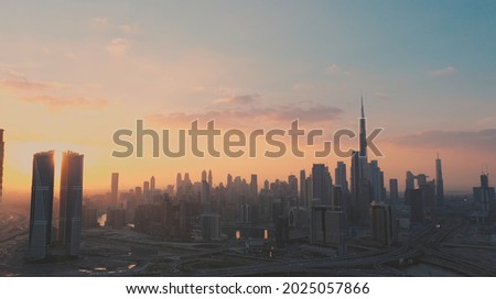 AERIAL. Top view of downtown Dubai at beautiful sunset, United Arab Emirates. Royalty-Free Stock Photo #2025057866