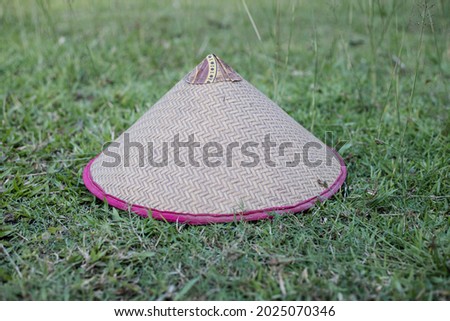 Hat made of bamboo and palm leaves, farmer hat. Image of handmade concept.