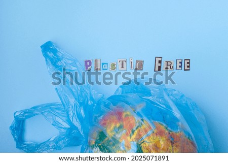 Plastic free words cut out of magazines. Flat lay, on a blue background. top view. High quality photo. High quality photo