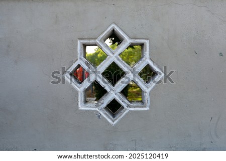 Ornaments on cement walls with pentagonal patterns that are good for building decoration