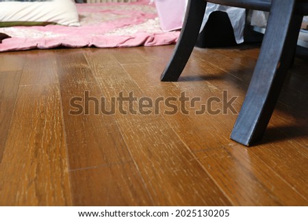 There are numerous scratches on the floor, scraped by the chair. Royalty-Free Stock Photo #2025130205