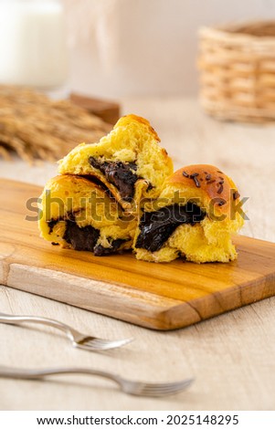 Roti sobek or Roti Gembong or Soft bread, This bread has a sweet taste with a soft texture. Usually filled with chocolate, cheese or grated coconut. Royalty-Free Stock Photo #2025148295
