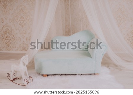 Couch for a baby photo session in a photo studio
