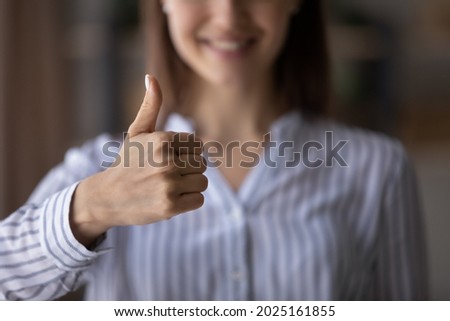 Crop close up of smiling woman show thumb up give recommendation to good quality customer service. Happy satisfied female client make hand gesture sign recommend best experience. Success concept. Royalty-Free Stock Photo #2025161855