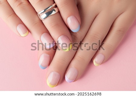 Close up manicured womans hands on pink background Royalty-Free Stock Photo #2025162698