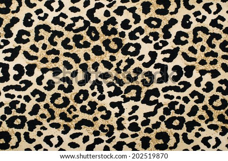 Brown and black leopard pattern. Animal print as background.