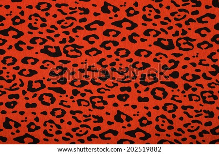 Black and red leopard pattern. Animal print as background.
