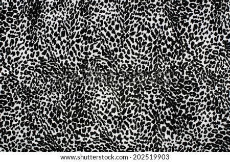 Black and white leopard pattern. Fur animal print as background.