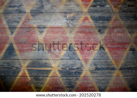 Painted pattern of rhomb on wooden floor