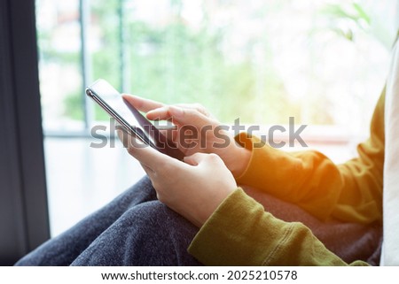 Closeup woman hand touch screen on smart phone, marketing technology and business concept.