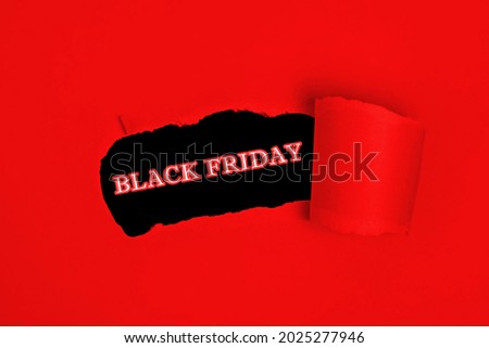 Red torn paper whole with black friday sale text promo