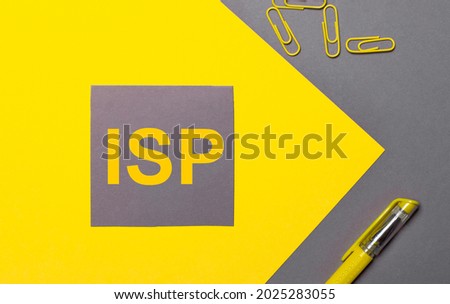 On a gray and yellow background, a gray sticker with yellow text ISP Internet Service Provider, yellow paper clips and a yellow pen