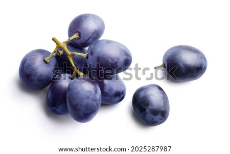 Bunch of ripe dark blue grapes Isolated on white background top view. Royalty-Free Stock Photo #2025287987
