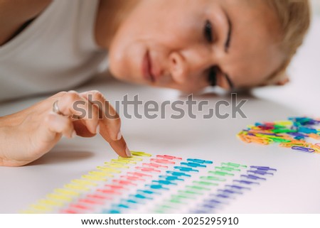 Obsessive compulsive disorder. Arranging Paperclips in a Row. Royalty-Free Stock Photo #2025295910